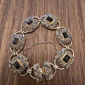 Elegant Gold and Black Filigree Bracelet